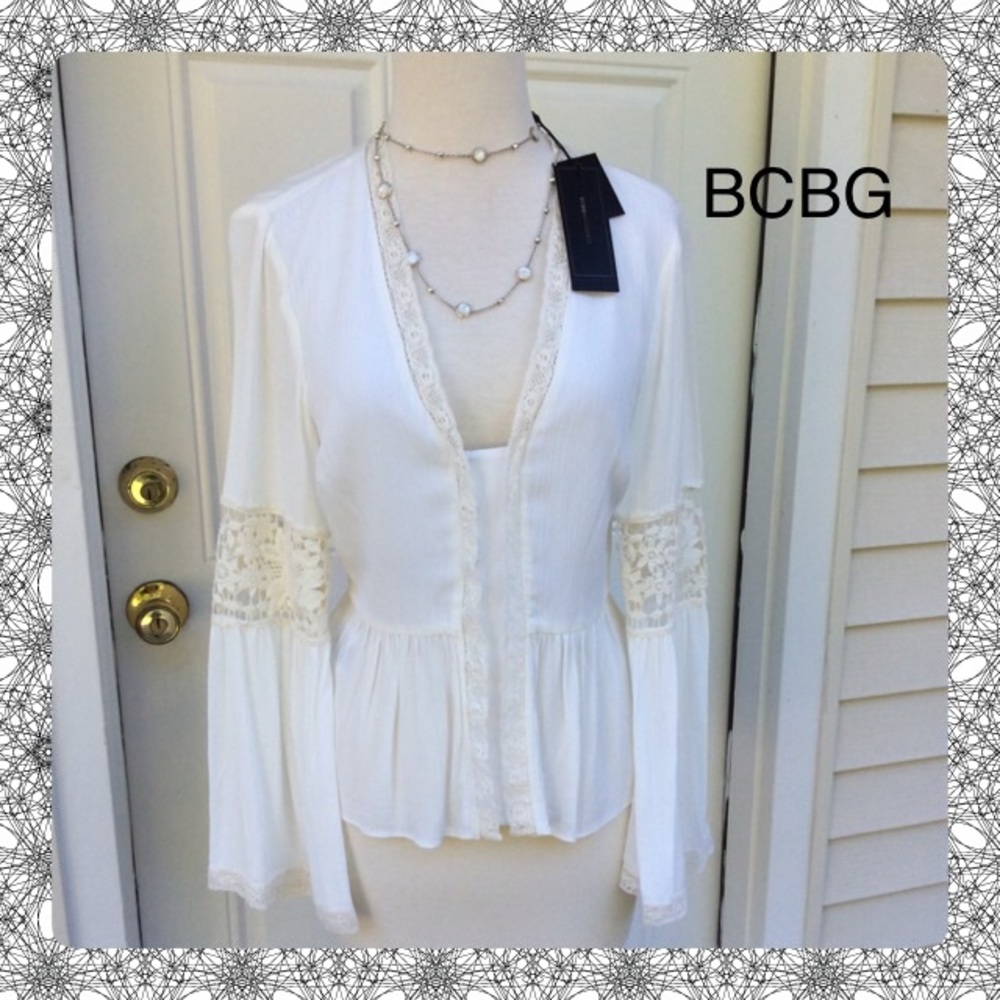 New BCBG Top that will Turn heads w bell sleeves